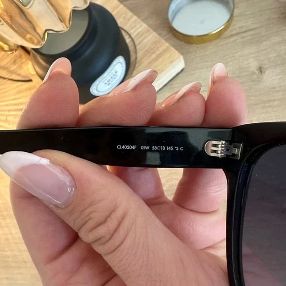 Black Sunglasses with Gold Logo Accents - Picture 3 of 5